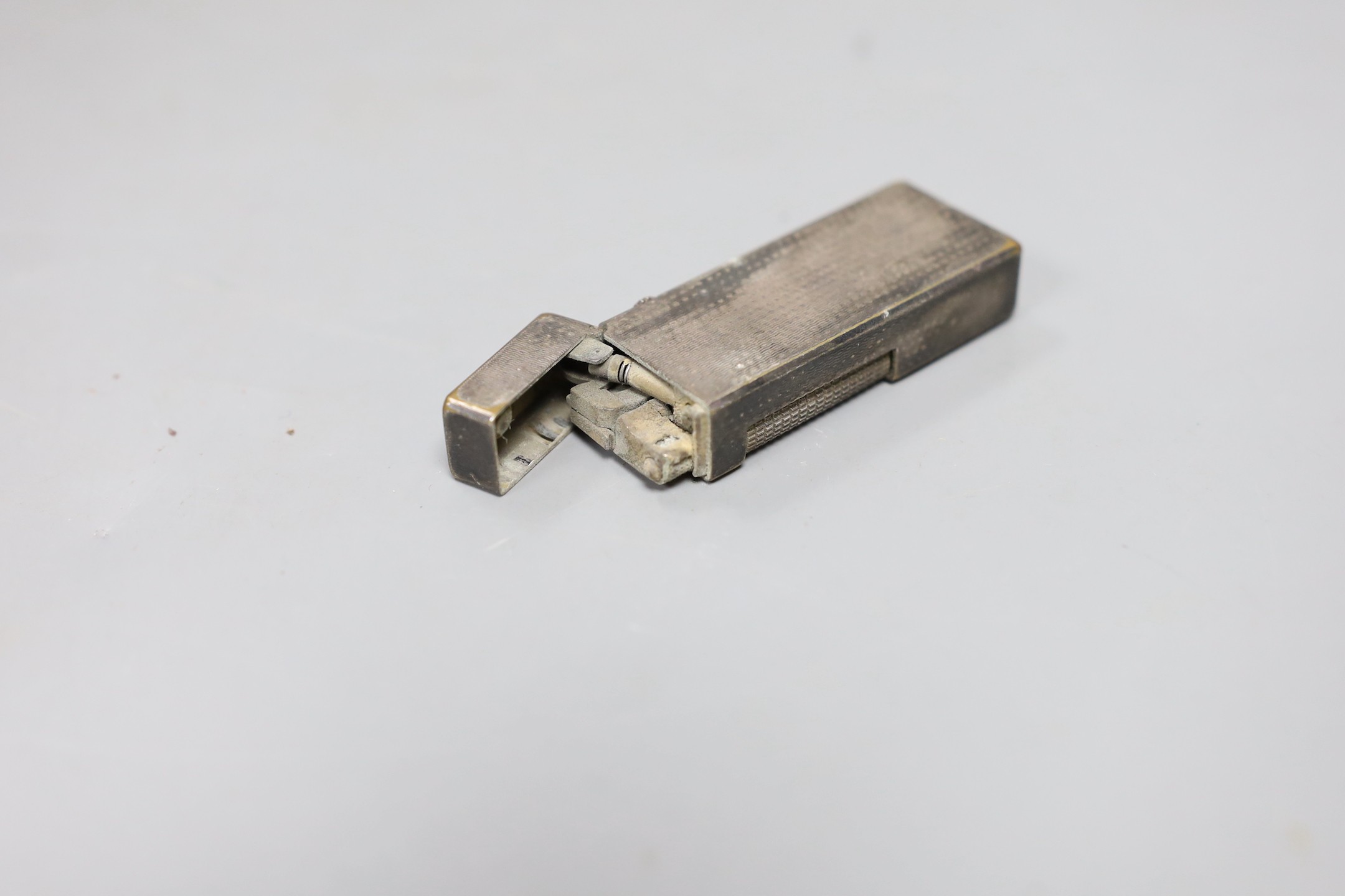 A Dunhill silver plated lighter, 6.5cms high